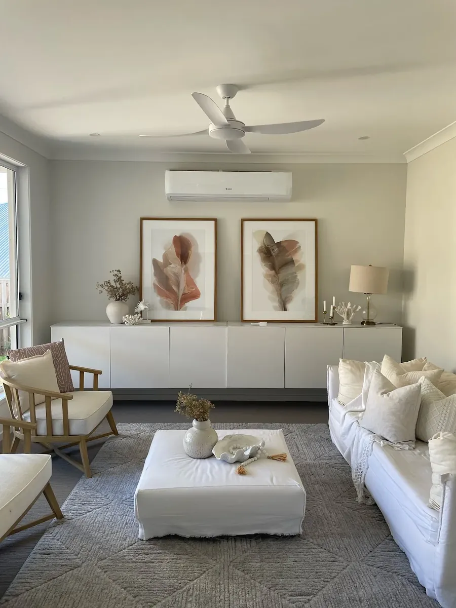 Bright lounge room with a white ceiling fan installed